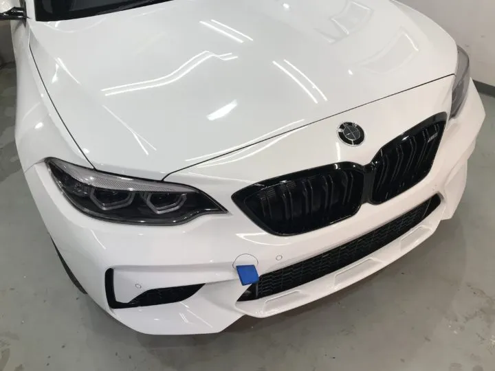 東京のBMWM2コンペティションのフロントバンパのプロテクションフィルム施工